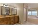 Bathroom featuring double vanity sinks and a bathtub with walk-in shower at 5911 E Peak View E Rd, Cave Creek, AZ 85331