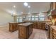 Bright kitchen with an island, granite countertops, and abundant cabinet space at 5911 E Peak View E Rd, Cave Creek, AZ 85331