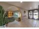 Stylish living room with tile floors, arched doorways, and plenty of natural light at 5911 E Peak View E Rd, Cave Creek, AZ 85331