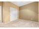 Bedroom with neutral walls, carpet, and a closet for storage at 5948 W Leiber Pl, Glendale, AZ 85310