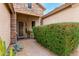 Inviting front entrance with a decorative security door, stone accents, and mature landscaping at 5948 W Leiber Pl, Glendale, AZ 85310