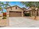 Charming single-Gathering home showcasing desert landscaping with cacti, gravel, and a mature tree at 5948 W Leiber Pl, Glendale, AZ 85310