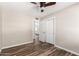 Comfortable bedroom with closet, ceiling fan, and wood-look flooring at 6427 E Grandview Dr, Scottsdale, AZ 85254