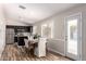 Dining area adjacent to kitchen, featuring a modern table, neutral décor, and outdoor access at 6427 E Grandview Dr, Scottsdale, AZ 85254