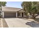 Well-maintained one-story home boasting a two-car garage and desert landscaping at 6427 E Grandview Dr, Scottsdale, AZ 85254