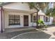 Inviting front porch with decorative door, updated windows, and xeriscaped yard at 6427 E Grandview Dr, Scottsdale, AZ 85254