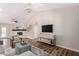 Bright living room showcasing a white-brick fireplace, modern decor, and wood-look floors at 6427 E Grandview Dr, Scottsdale, AZ 85254