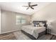 Spacious main bedroom with ceiling fan, natural light, and stylish decor at 6427 E Grandview Dr, Scottsdale, AZ 85254