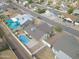 Aerial view of the property with its refreshing pool, complemented by nearby residential homes and desert surroundings at 655 W Mission Dr, Chandler, AZ 85225