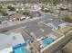 Aerial view showcasing the home's private backyard oasis with a pool and lush landscaping in a residential neighborhood at 655 W Mission Dr, Chandler, AZ 85225