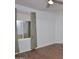 Bedroom with wood flooring, a ceiling fan, and a window with curtains for natural light at 655 W Mission Dr, Chandler, AZ 85225