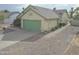 Quaint single-story home with desert-style landscaping, and an inviting facade with a painted garage door at 655 W Mission Dr, Chandler, AZ 85225