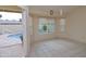 Cozy living room with tile floors and a view of the pool and backyard at 655 W Mission Dr, Chandler, AZ 85225