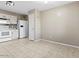 Eat in kitchen features white appliances, and tiled flooring at 7147 S Morning Dew Ln, Buckeye, AZ 85326