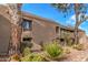 Charming exterior of a multi-story home with well-maintained landscaping and mature trees at 7428 N Via Camello Del Norte -- # 182, Scottsdale, AZ 85258