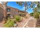 Charming exterior of a multi-story home with well-maintained landscaping and mature trees at 7428 N Via Camello Del Norte -- # 182, Scottsdale, AZ 85258