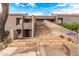 Inviting home exterior featuring well-manicured landscaping, a tiled staircase, and neutral color palette at 7428 N Via Camello Del Norte -- # 182, Scottsdale, AZ 85258