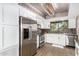 Bright kitchen featuring stainless steel appliances, white cabinetry, and recessed lighting at 7428 N Via Camello Del Norte -- # 182, Scottsdale, AZ 85258