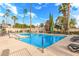 Community pool with several lounge chairs and palm trees for a resort style experience at 7428 N Via Camello Del Norte -- # 182, Scottsdale, AZ 85258