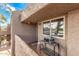 Cozy porch with outdoor grill, tiled flooring, and a view of surrounding greenery at 7428 N Via Camello Del Norte -- # 182, Scottsdale, AZ 85258