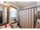 Bathroom boasts natural light and a shower curtain over the tub at 853 E Ross Ave, Phoenix, AZ 85024