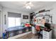 Bedroom featuring a bed, a desk, and shelving at 853 E Ross Ave, Phoenix, AZ 85024