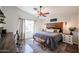 Bedroom features a bed, a desk, and a ceiling fan at 853 E Ross Ave, Phoenix, AZ 85024