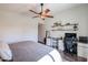 Bedroom features a bed, a desk, and a ceiling fan at 853 E Ross Ave, Phoenix, AZ 85024