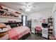 Bright bedroom featuring a decorated desk and shelving at 853 E Ross Ave, Phoenix, AZ 85024