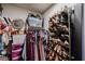 Walk-in closet with clothing racks, shoe shelves, and storage bins for organized storage at 853 E Ross Ave, Phoenix, AZ 85024