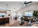 Open-concept floor plan of the living room features a dining area, and an island with bar seating at 853 E Ross Ave, Phoenix, AZ 85024