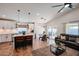 The modern kitchen and dining area opens up to a cozy Gathering room with an island and bar seating at 853 E Ross Ave, Phoenix, AZ 85024