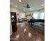 Bright living room featuring hardwood floors, a piano and cello, and an abundance of natural light at 853 E Ross Ave, Phoenix, AZ 85024