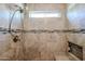 Elegant tile shower with mosaic accent and convenient built-in shower niche with storage at 853 E Ross Ave, Phoenix, AZ 85024