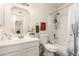 Bright bathroom featuring a white vanity, tub with cactus curtain, and funny bathroom rules sign at 870 S Palm Ln # 55, Chandler, AZ 85225