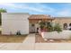 Charming front entrance with a tiled roof and a walkway leading to the front door and a well-maintained flower garden at 870 S Palm Ln # 55, Chandler, AZ 85225