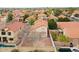 Backyard aerial view featuring a pool, patio area and luscious greenery at 909 W San Mateo Ct, Gilbert, AZ 85233