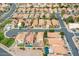 Aerial view of a residential neighborhood featuring red tile roofs and well-maintained landscaping at 909 W San Mateo Ct, Gilbert, AZ 85233