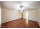 Large bedroom featuring wood laminate flooring, neutral walls, and a ceiling fan at 909 W San Mateo Ct, Gilbert, AZ 85233