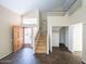 Bright foyer featuring soaring ceilings, tiled floors, and a staircase leading to the upper level at 909 W San Mateo Ct, Gilbert, AZ 85233