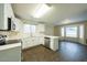 Open kitchen featuring white cabinetry, stainless steel appliances, and a breakfast bar at 909 W San Mateo Ct, Gilbert, AZ 85233