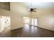 Open living room featuring high ceilings, and ample natural light with access to the kitchen at 909 W San Mateo Ct, Gilbert, AZ 85233