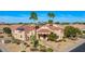 Beautiful home featuring desert landscaping, a tiled roof, and solar panels for energy efficiency at 9160 E Wethersfield Rd, Scottsdale, AZ 85260