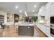 Bright and airy kitchen featuring granite countertops, custom cabinets, and stainless steel appliances at 9160 E Wethersfield Rd, Scottsdale, AZ 85260