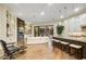 Open-concept living room with built-in shelving, fireplace, and sliding glass doors offering backyard views at 9160 E Wethersfield Rd, Scottsdale, AZ 85260