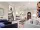 Open-concept living room with modern finishes, recessed lighting, and a built-in wet bar at 9160 E Wethersfield Rd, Scottsdale, AZ 85260