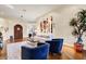 Bright living room featuring hardwood floors, modern decor, and a textured art installation at 9160 E Wethersfield Rd, Scottsdale, AZ 85260