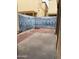 View of a small brick patio area with painted murals on the surrounding walls at 1018 W Libra Dr, Tempe, AZ 85283