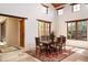 Bright dining room with large windows, elegant furnishings, and a warm, inviting atmosphere at 10597 E Rising Sun Dr, Scottsdale, AZ 85262