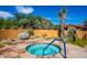 Inviting hot tub in a landscaped area with desert plants and a calming atmosphere at 10597 E Rising Sun Dr, Scottsdale, AZ 85262